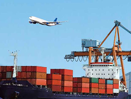 Airplane flying over cargo ship